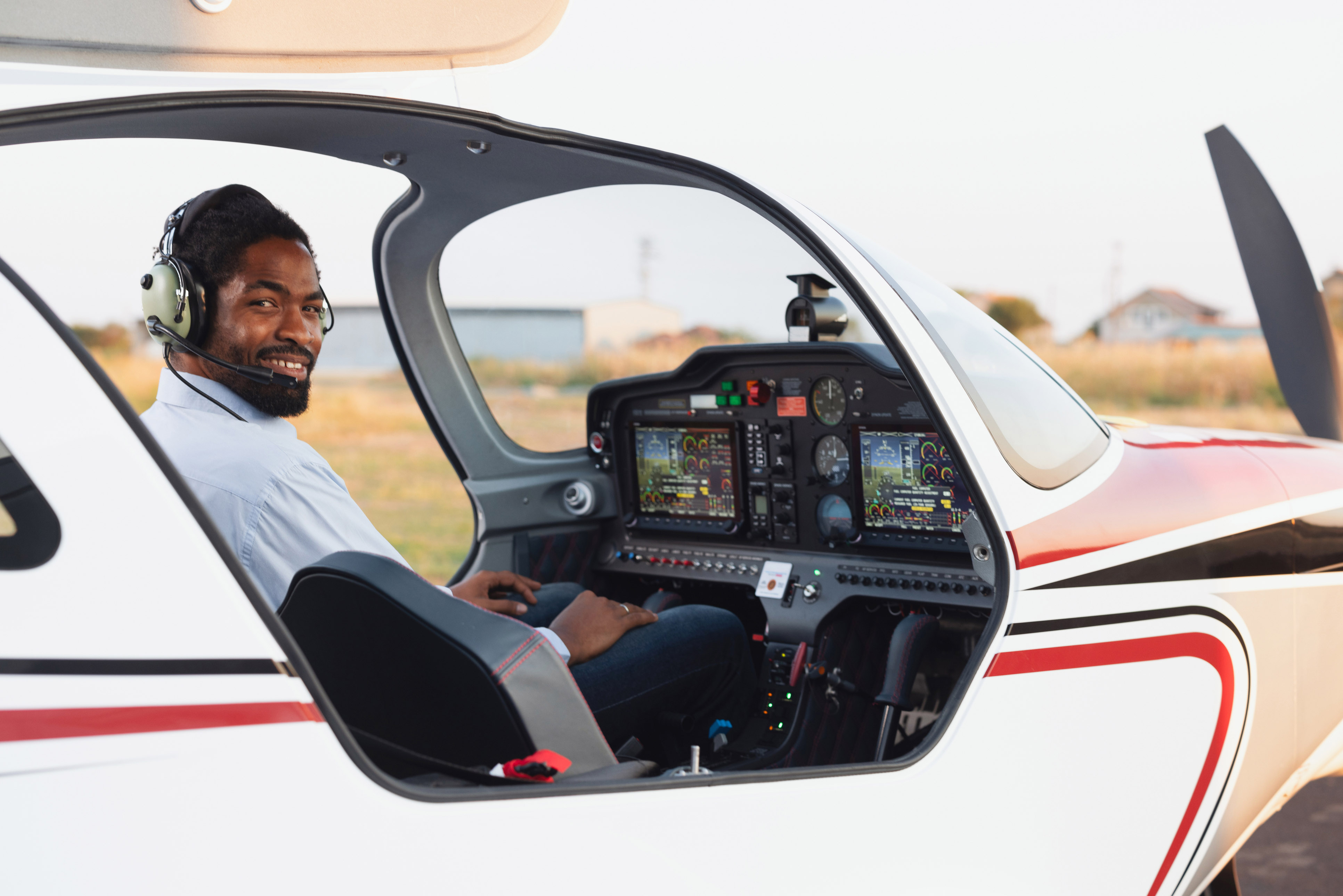 Man in the cockpit of a small airplane